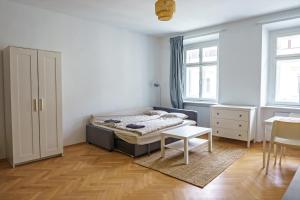 Posteľ alebo postele v izbe v ubytovaní Vienna City Apartments Barnabitengasse