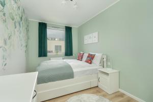 Katil atau katil-katil dalam bilik di Apartment with 2 Bedrooms and FREE GARAGE Poznań by Noclegi Renters +12 gambar