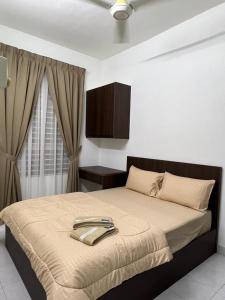 a bedroom with a large bed in a room at 162 RESIDENCY SELAYANG in Batu Caves