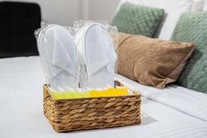 a basket sitting on top of a bed at Quattro Beachfront Sea View Ap 206 in Larnaka