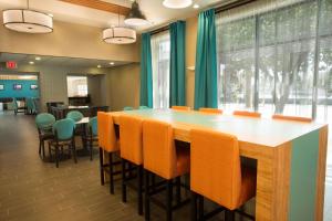 a conference room with a large table and chairs at Pear Tree Inn San Antonio Airport in San Antonio