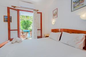 Postel nebo postele na pokoji v ubytování Athina Villas