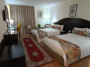 Postel nebo postele na pokoji v ubytování Royal Mirage Fes Hotel