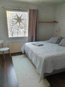 Postel nebo postele na pokoji v ubytování Arctic Villa Kulppilatie