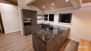 Kuchyň nebo kuchyňský kout v ubytování Mountain - Lake Apartement 1