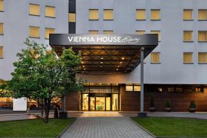 a building with a sign on the front of it at Vienna House Easy by Wyndham Cracow in Krakow +100 photos