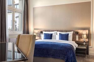 Posteľ alebo postele v izbe v ubytovaní Wyndham Grand Krakow Old Town