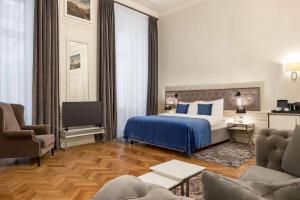 Posteľ alebo postele v izbe v ubytovaní Wyndham Grand Krakow Old Town