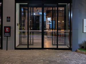 an entrance to a building with revolving doors at ibis Barra do Garcas in Barra do Garças