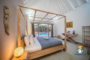 Кровать или кровати в номере Villa Eva - by Unicorn Villas Bali