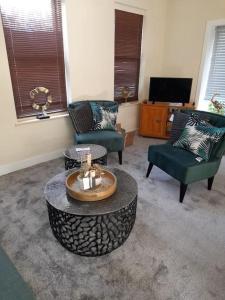 Posezení v ubytování Dorset Lodge Flat 3