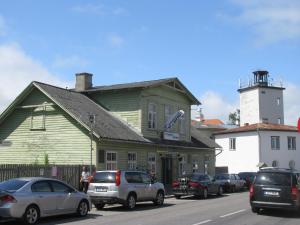 a group of cars parked in front of a building at Karja Tented Campsite in Haapsalu