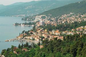 a town on a hill next to a body of water at -New- Apartment Nara -Heart of Opatija- in Opatija