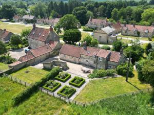 an aerial view of an old house with a yard at Coral Cottage at Castle Howard in York