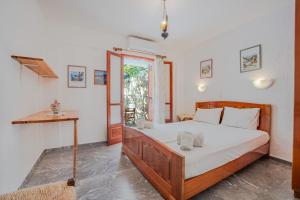 Postel nebo postele na pokoji v ubytování Athina Villas