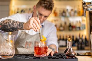 a man in a kitchen making a drink at The Nici in Bournemouth