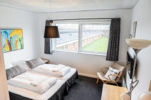 Postel nebo postele na pokoji v ubytování Hotel Herning