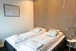 Postel nebo postele na pokoji v ubytování Hotel Herning