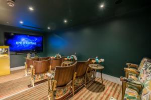 a waiting room with chairs and a large screen at The Nici in Bournemouth