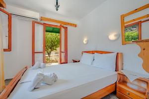 Postel nebo postele na pokoji v ubytování Athina Villas