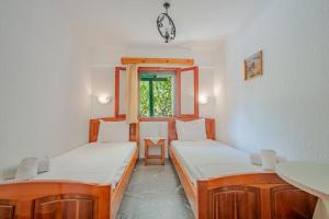 Postel nebo postele na pokoji v ubytování Athina Villas
