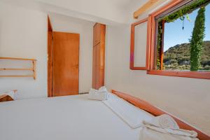 Postel nebo postele na pokoji v ubytování Athina Villas