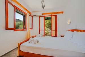 Postel nebo postele na pokoji v ubytování Athina Villas