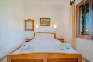 Postel nebo postele na pokoji v ubytování Athina Villas