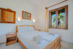 Postel nebo postele na pokoji v ubytování Athina Villas
