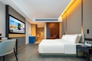 TV a/nebo společenská místnost v ubytování Atour Hotel Meizhou West Station R&F Center