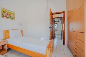 Postel nebo postele na pokoji v ubytování Athina Villas