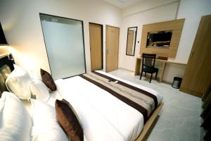 Postel nebo postele na pokoji v ubytování HOTEL ALFA EXECUTIVE