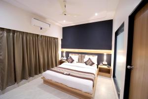 Postel nebo postele na pokoji v ubytování HOTEL ALFA EXECUTIVE