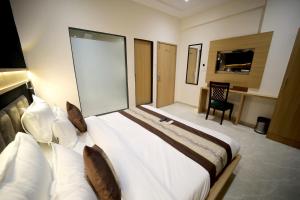 Postel nebo postele na pokoji v ubytování HOTEL ALFA EXECUTIVE
