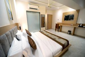 Postel nebo postele na pokoji v ubytování HOTEL ALFA EXECUTIVE