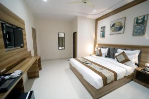 Postel nebo postele na pokoji v ubytování HOTEL ALFA EXECUTIVE