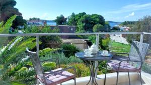 a balcony with a table and chairs and a view at Refresh Boutique Apartments in Vodice