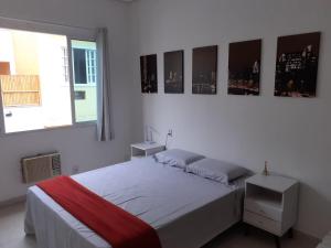 A bed or beds in a room at Suíte Privativa em Casa de Vila