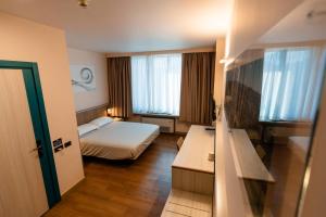 Postel nebo postele na pokoji v ubytování Hotel Ristorante I Castelli + 37 fotografií