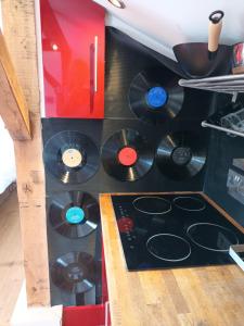 a group of cds in a box in a kitchen at The Music Room - Kingsize Double - Sleeps 2 - Quirky - Rural in Haslemere