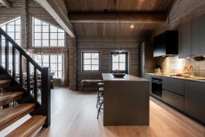a kitchen with a island in the middle of a room at Villa Hjelmbacken in Idre