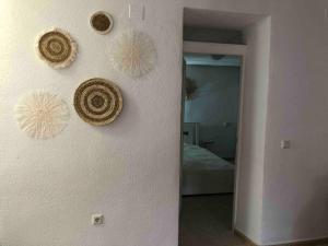 a room with a wall with some decorations on it at Casa Vincent, 350 m tot strand, airco in Villajoyosa
