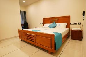 Postel nebo postele na pokoji v ubytování Grand Residency & Resort