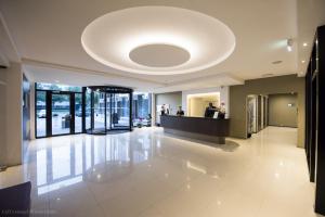 a large lobby with a large ceiling at OZO Hotels Arena Amsterdam in Amsterdam