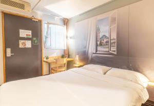 Postel nebo postele na pokoji v ubytování B&B HOTEL Limoges 2