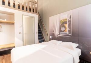 Postel nebo postele na pokoji v ubytování B&B HOTEL Limoges 2