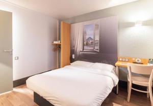 Postel nebo postele na pokoji v ubytování B&B HOTEL Limoges 2