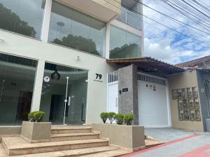 a building with stairs and a number on it at Hotel APART Zuccolotto 303 in Aracruz