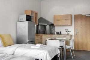 Kuchyň nebo kuchyňský kout v ubytování Máni Apartments