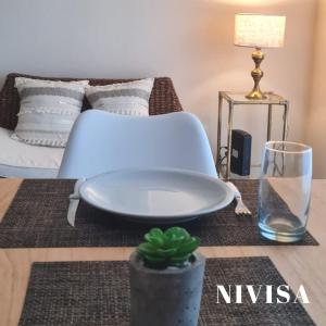 a living room with a plate on a table with a couch at Edificio NIVISA in Posadas